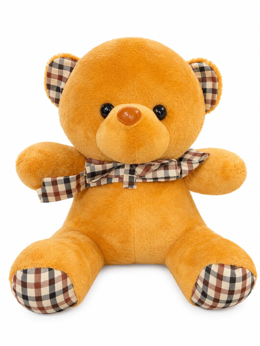 Golden-brown bear with classic plaid bow and ear accents